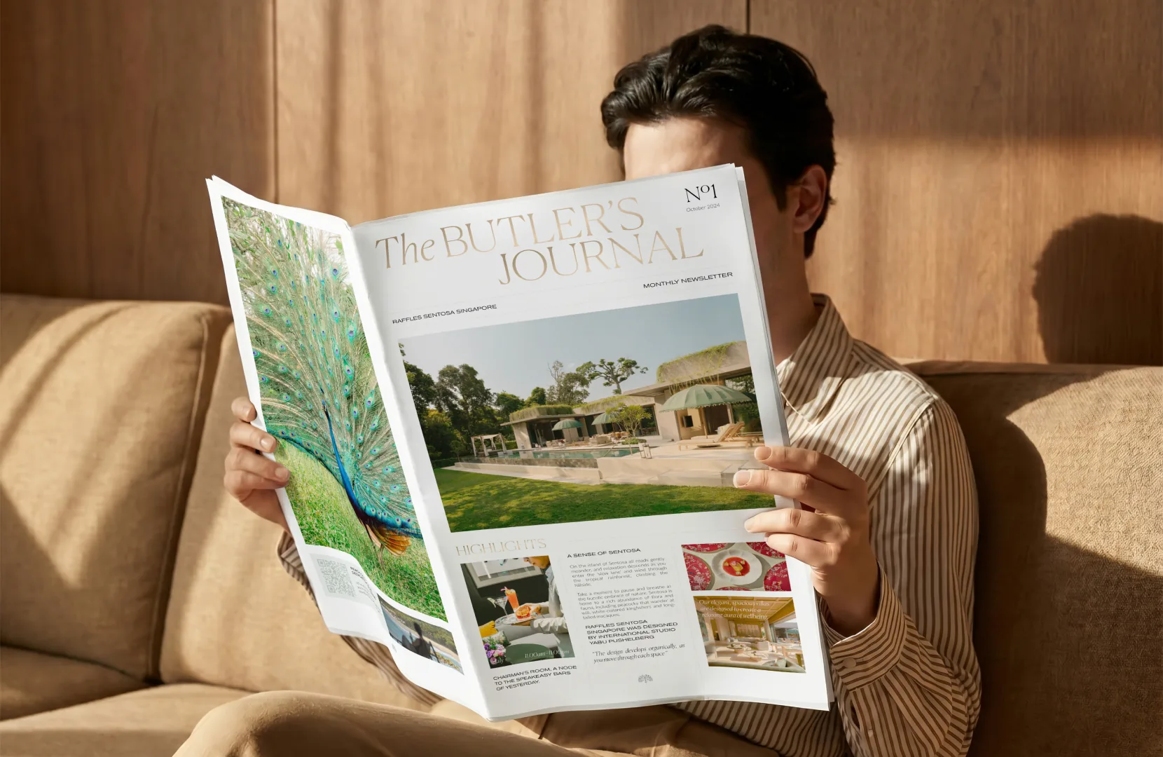 Guest reading The Butler's Journal, a hotel newspaper