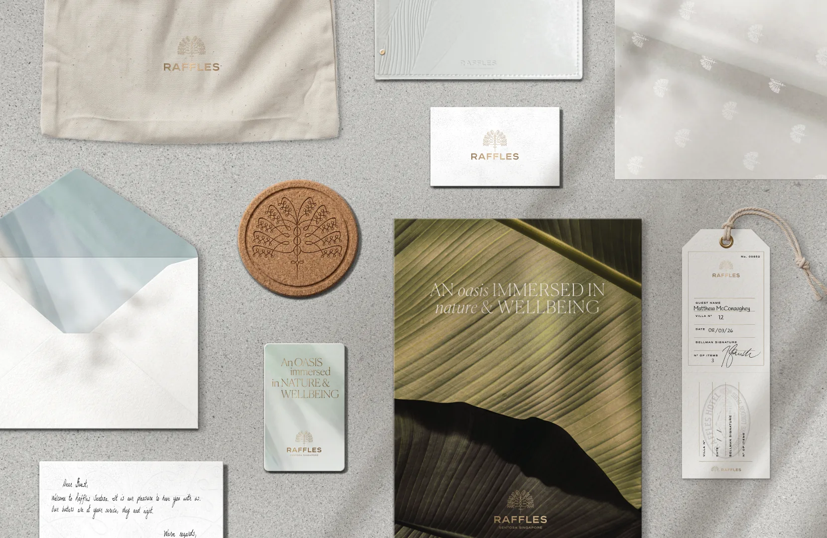 Raffles hotel stationery flatlay: letterhead, envelope, cards and luggage tag
