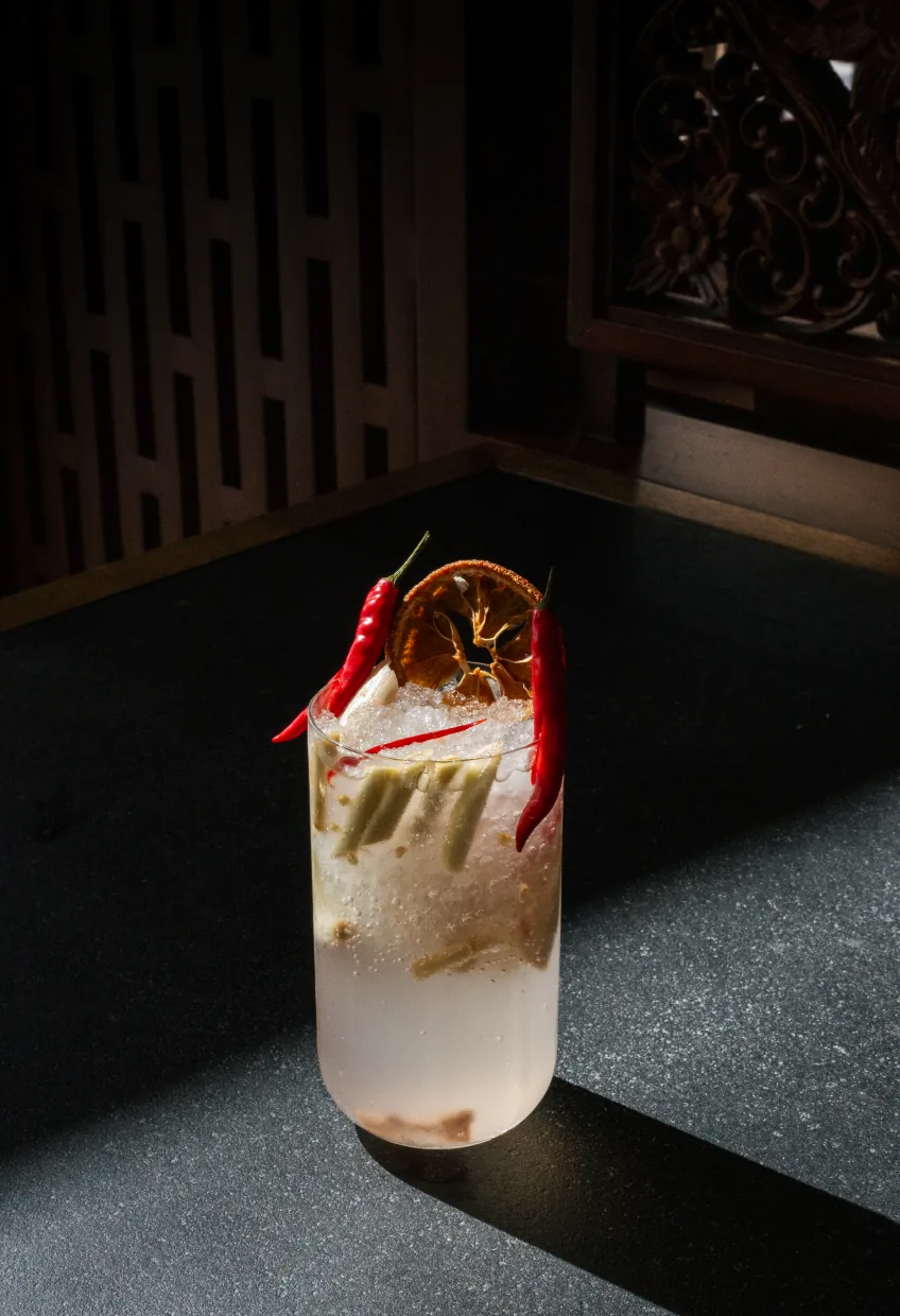 Cocktail garnished with chilli and dried citrus at Banyan Tree AlUla