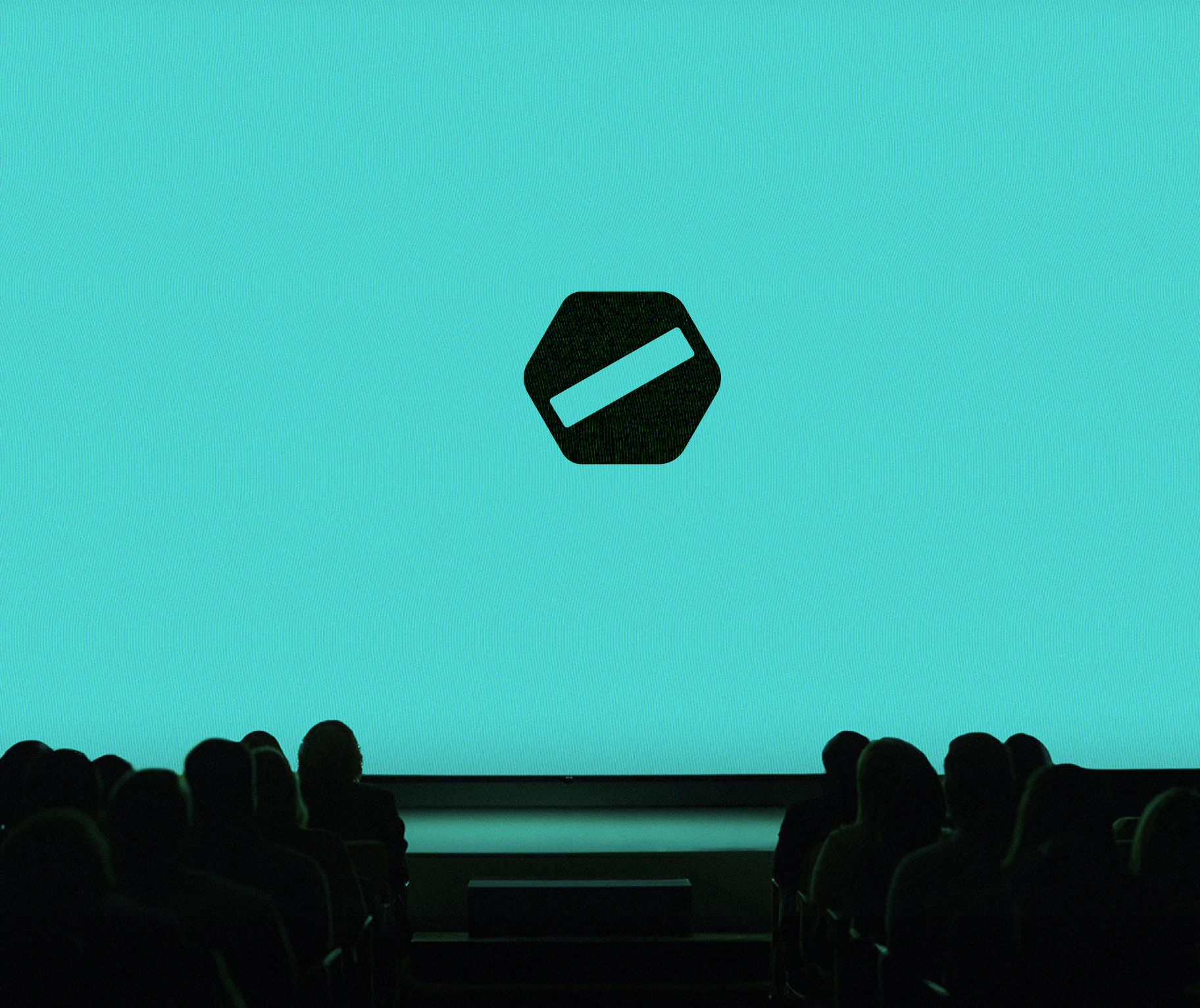 Airon hexagonal bolt symbol projected on a turquoise conference screen above a silhouetted audience.