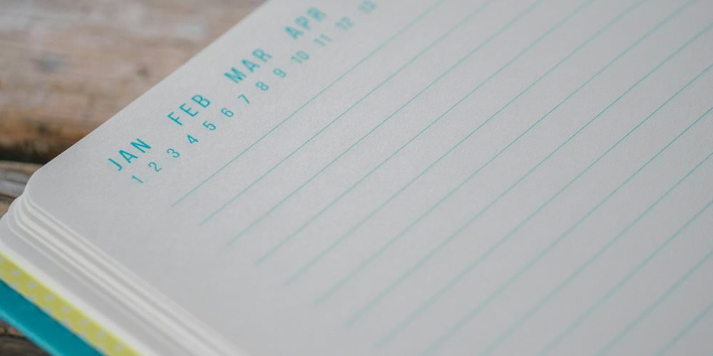 Open planner page with month labels across the top