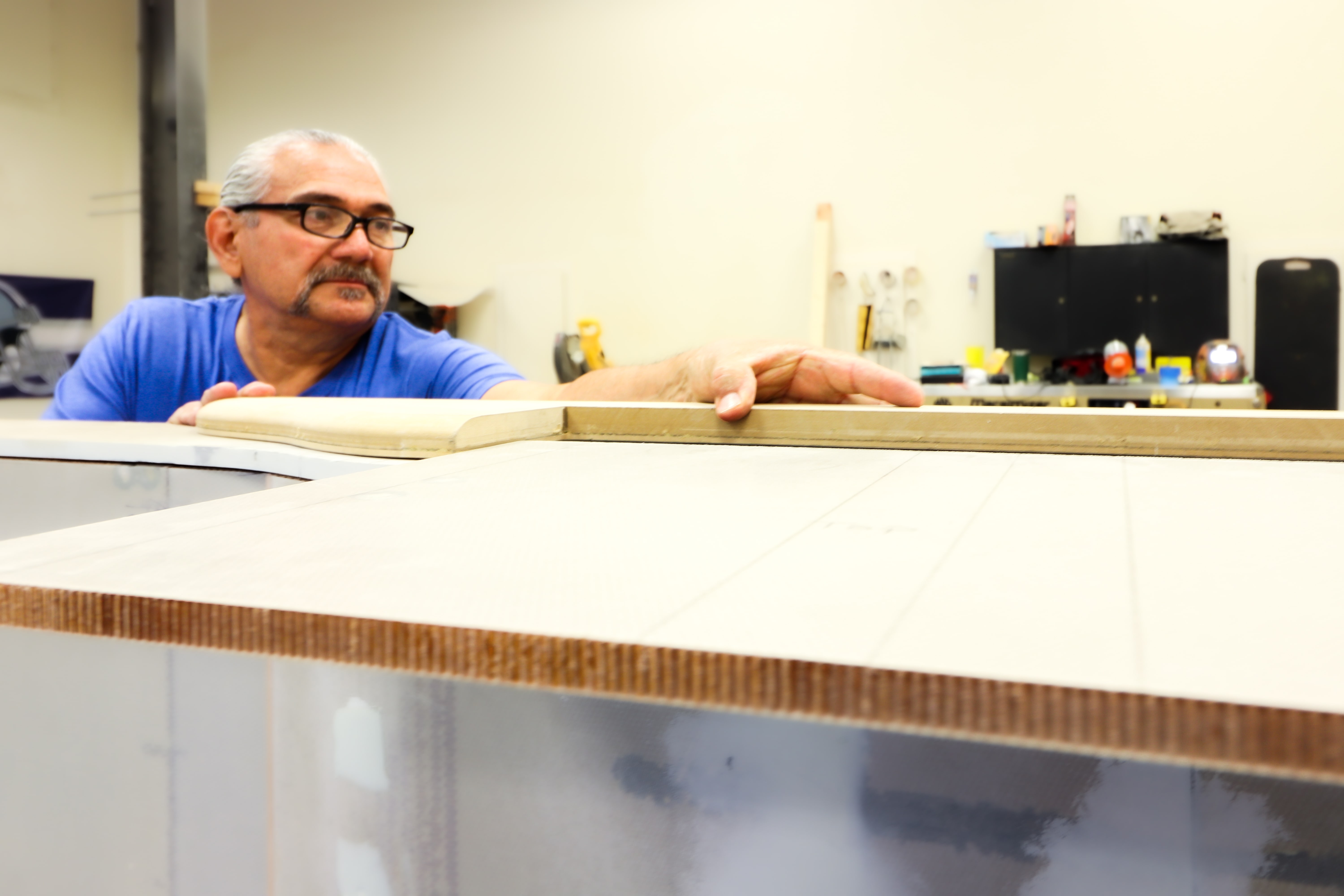 Master cabinetmaker checking a veneer panel