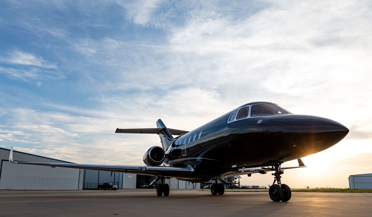 Hawker business jet with completed Avtec interior, on the ramp at sunset