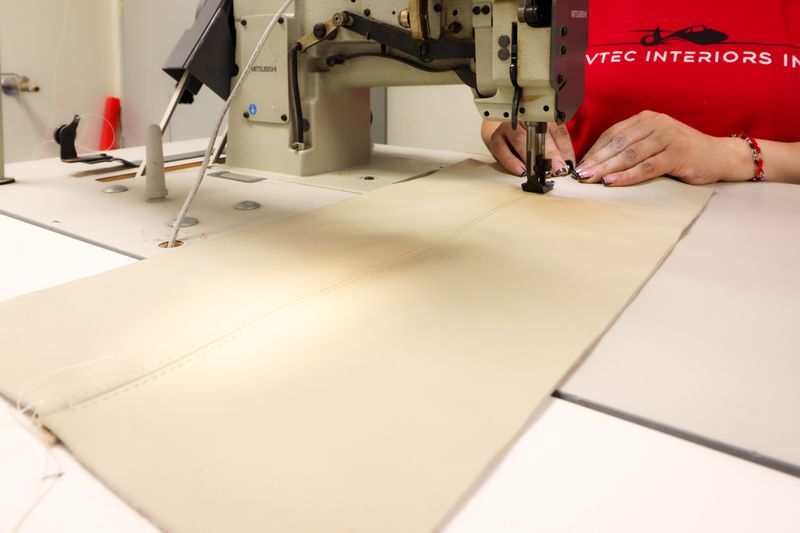Seam work on leather at the sewing bench