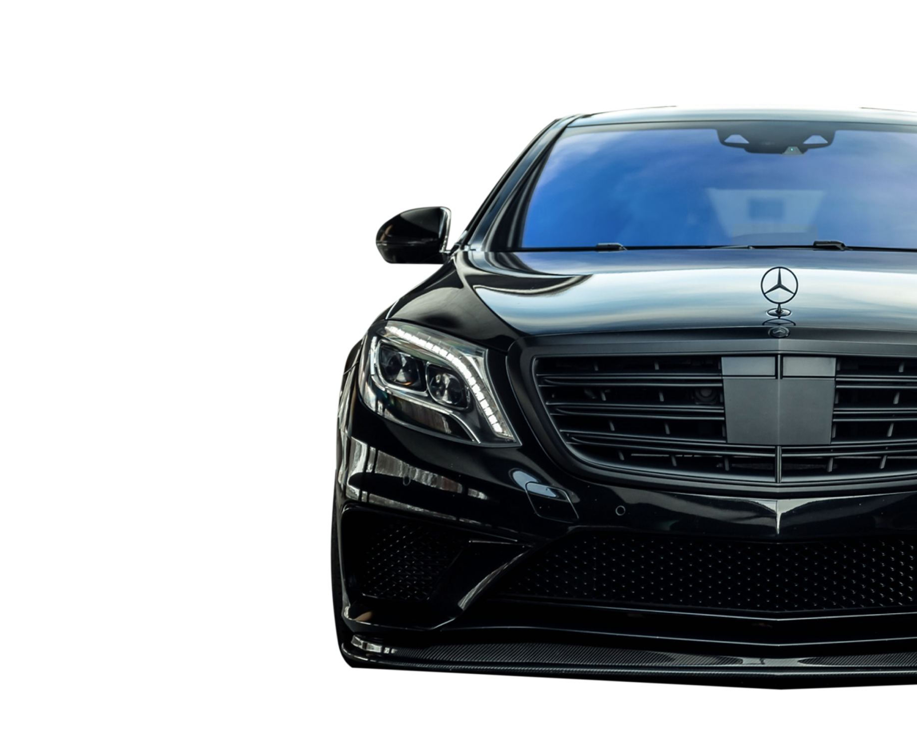 Front view of a shiny black Mercedes-Benz car with distinct grille and headlights.