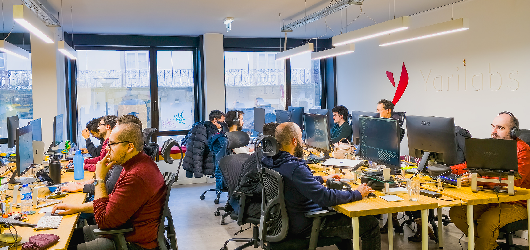 Two partners having a collaborative discussion at their desks