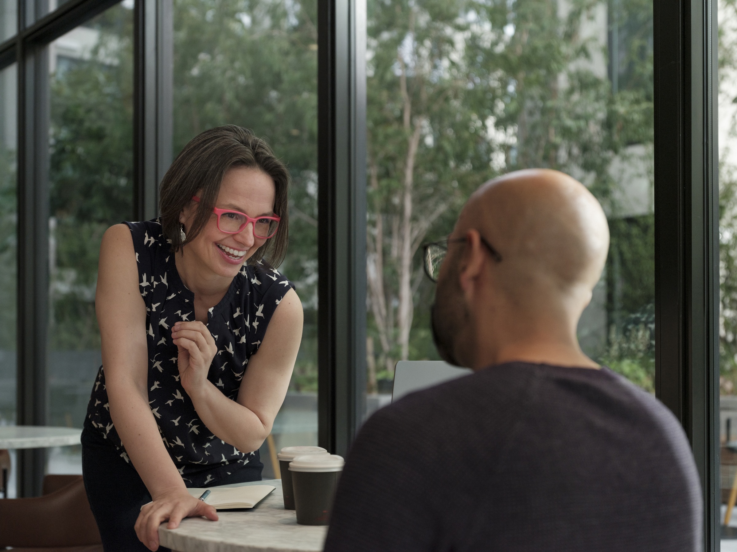 Female black recruiter interviews black male job seeker