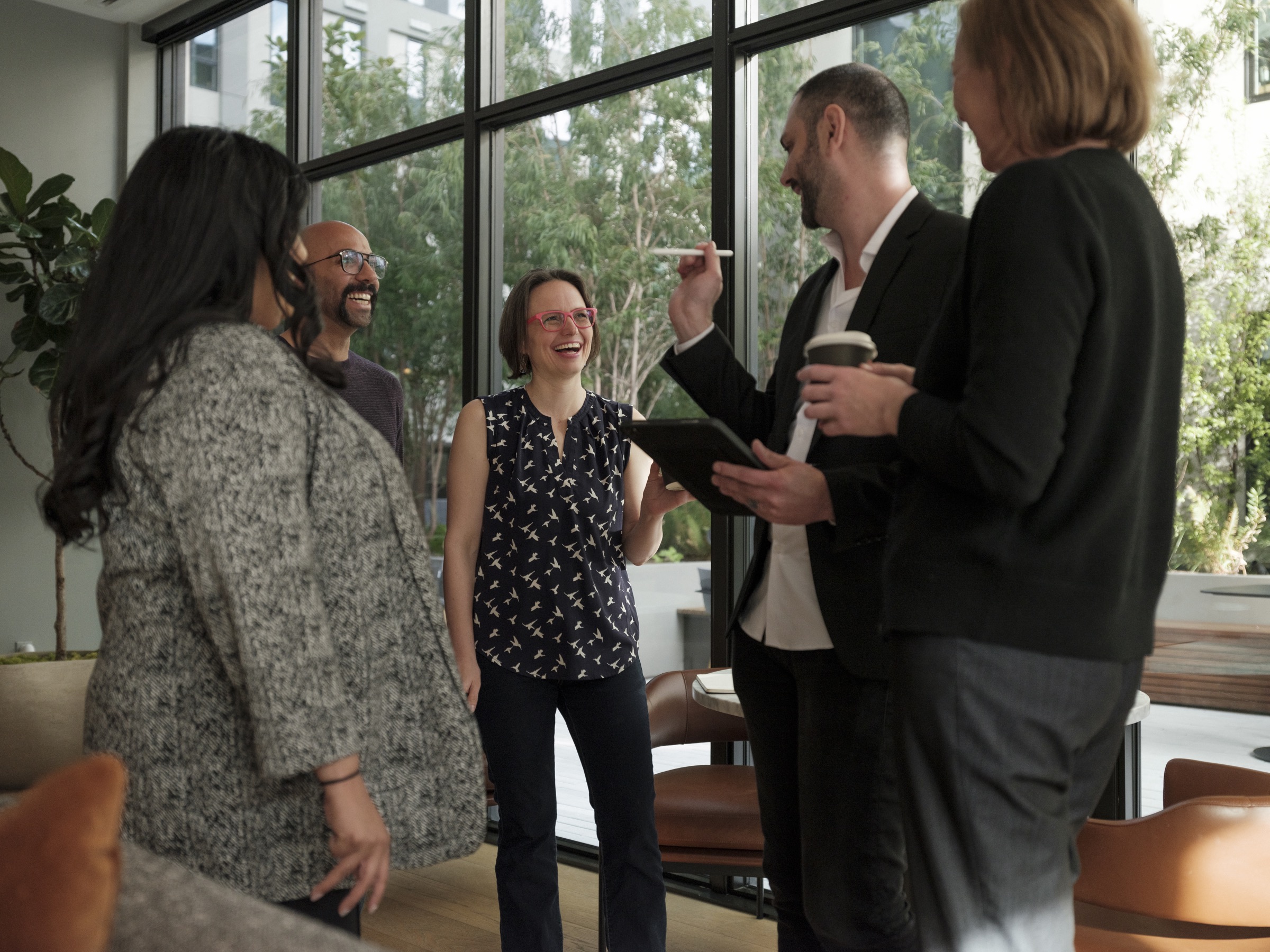 Young female is presented to a group of people at work
