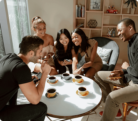 A happy group of people drinking coffee together