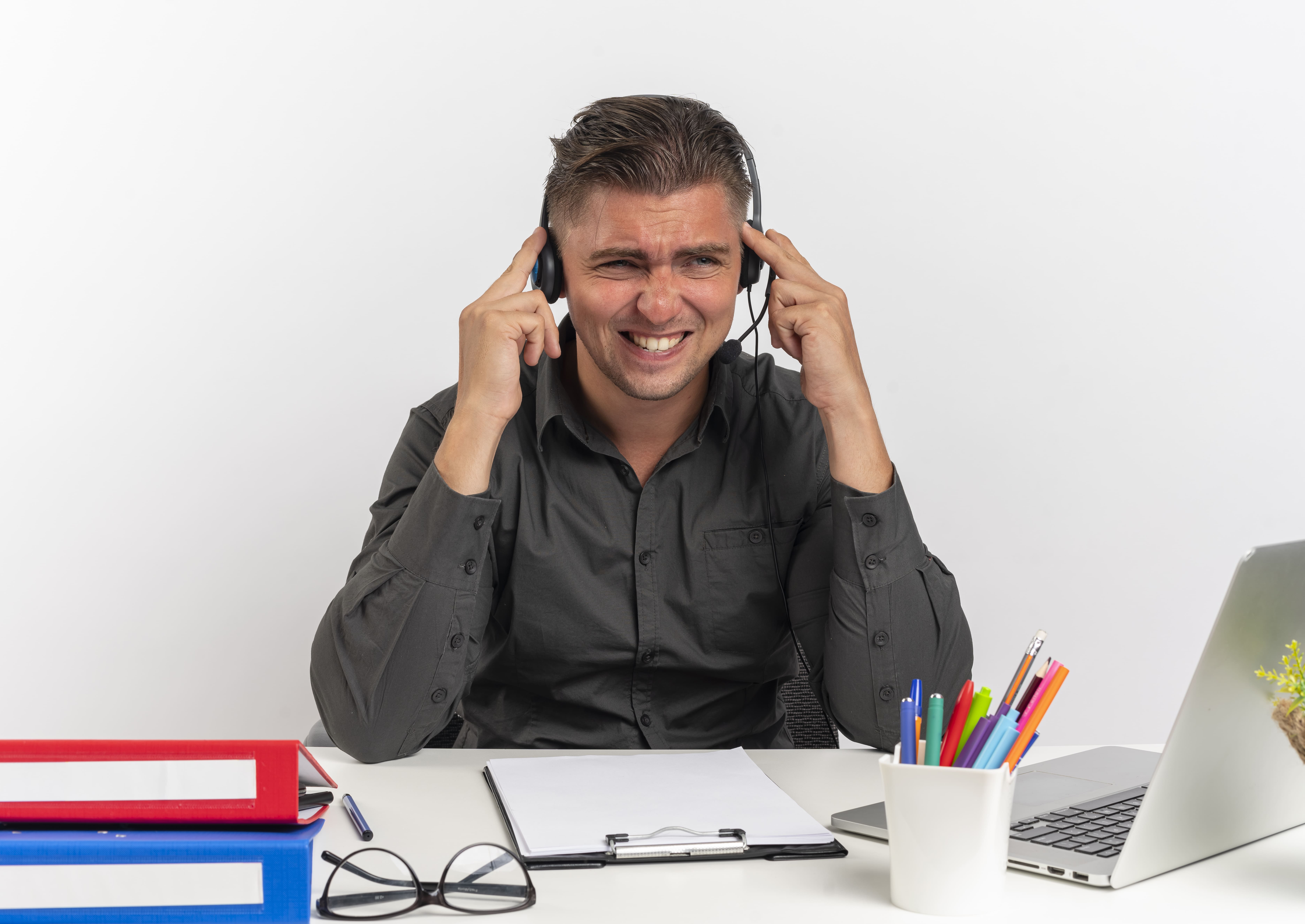 Annoyed call center agent wearing a headset, signaling an issue during a recorded video meeting