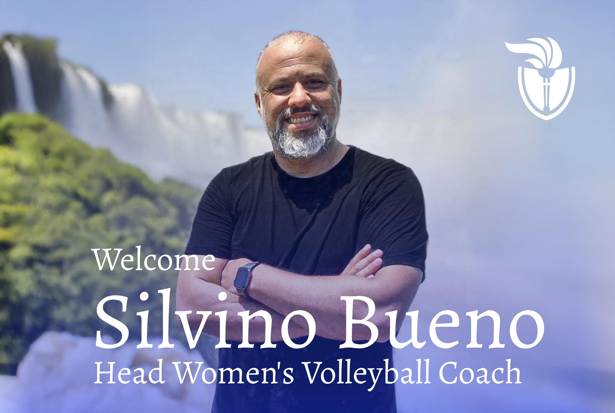 Silvino Bueno. A Brazilian man standing in front of a waterfall smiling looking towards the camera.