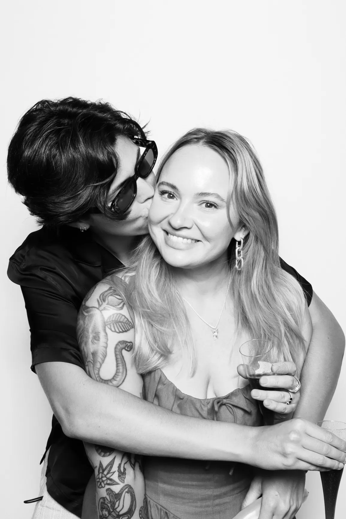 Black and white photo booth rental. People posing for Palace Aesthetics Grand Opening in Portland.