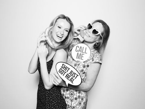 Black and white photo booth rental. Mother and daughter pose during Palace Aesthetics Grand Opening in Portland.