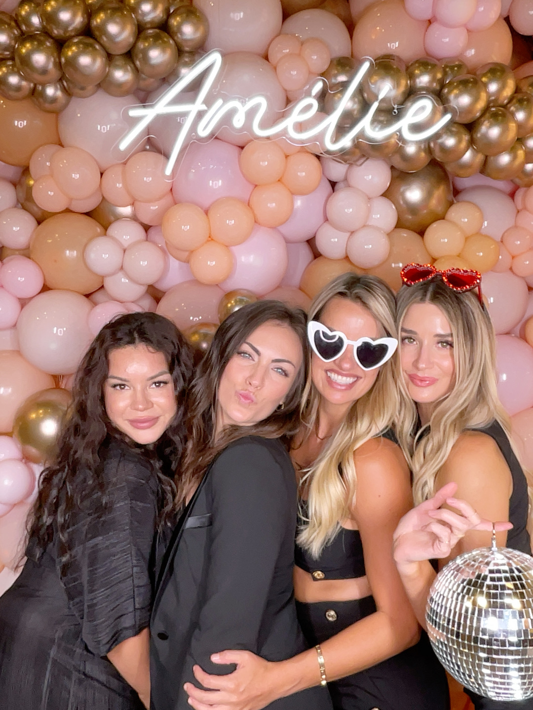 Group posing for a selfie station photo