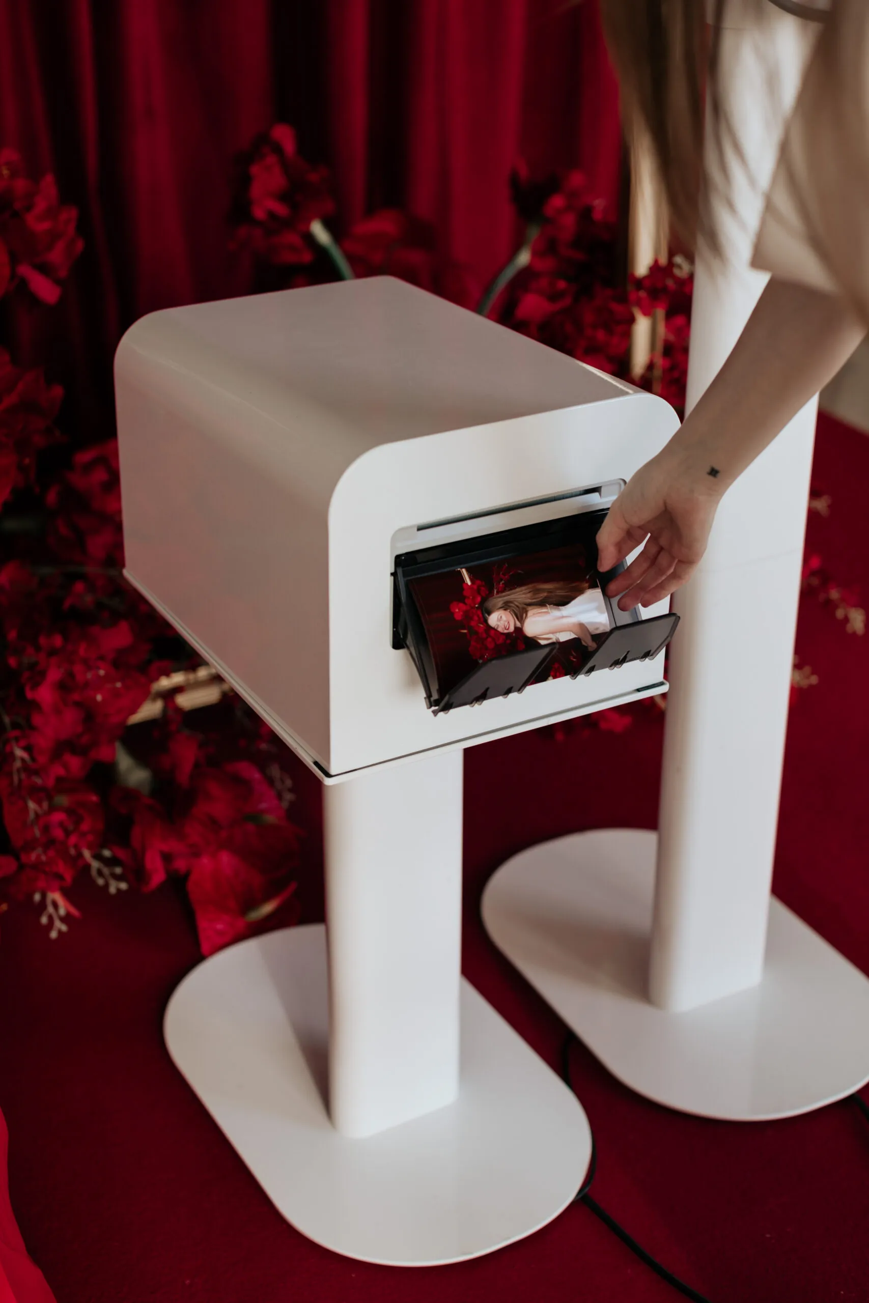 Studio Booth photo booth setup with printer developing prints at Portland wedding venue