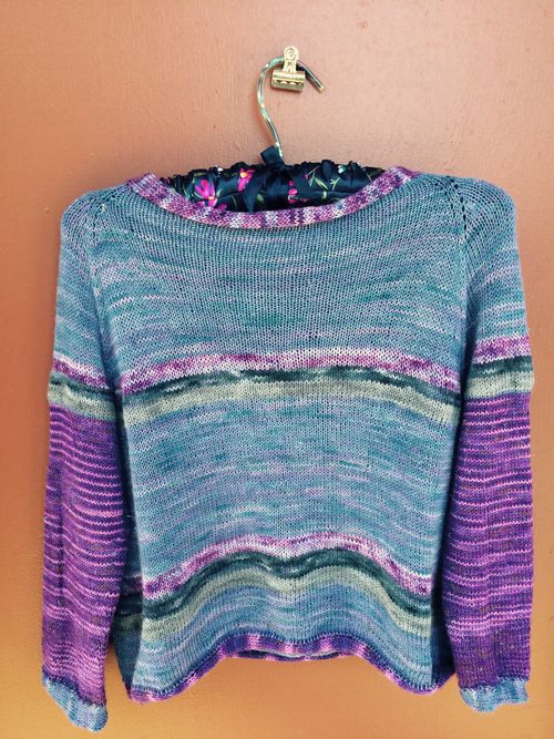 a knitted sweater in shades of violet