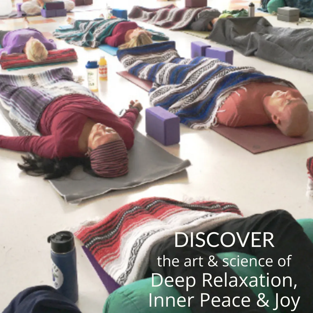 students lying on their backs on yoga mats in savasana