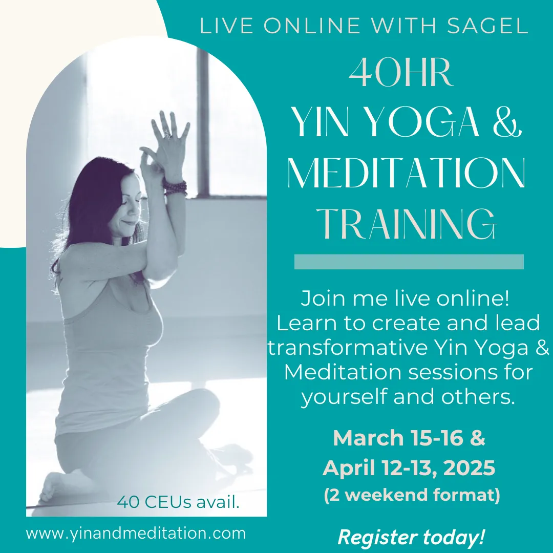 a yoga teacher in a seated yoga pose