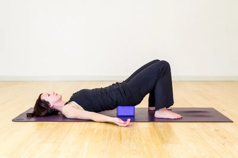 a female do yin yoga bridge pose
