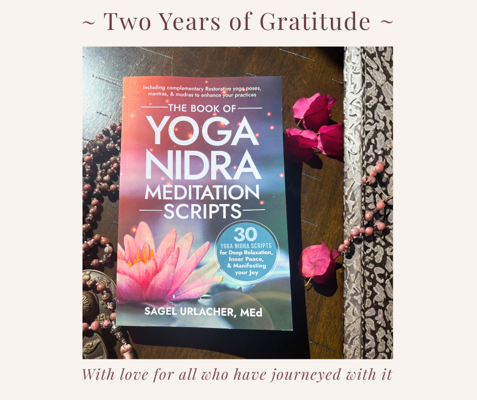the book of yoga nidra scripts cover with mala and rose petals