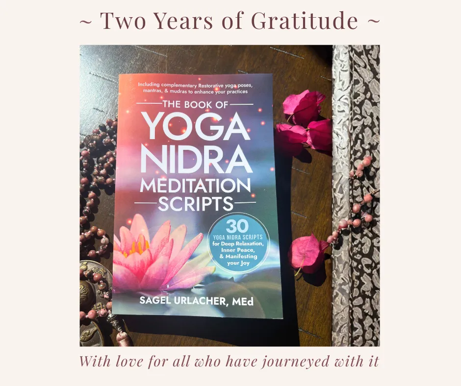 the book of yoga nidra scripts cover with mala and rose petals