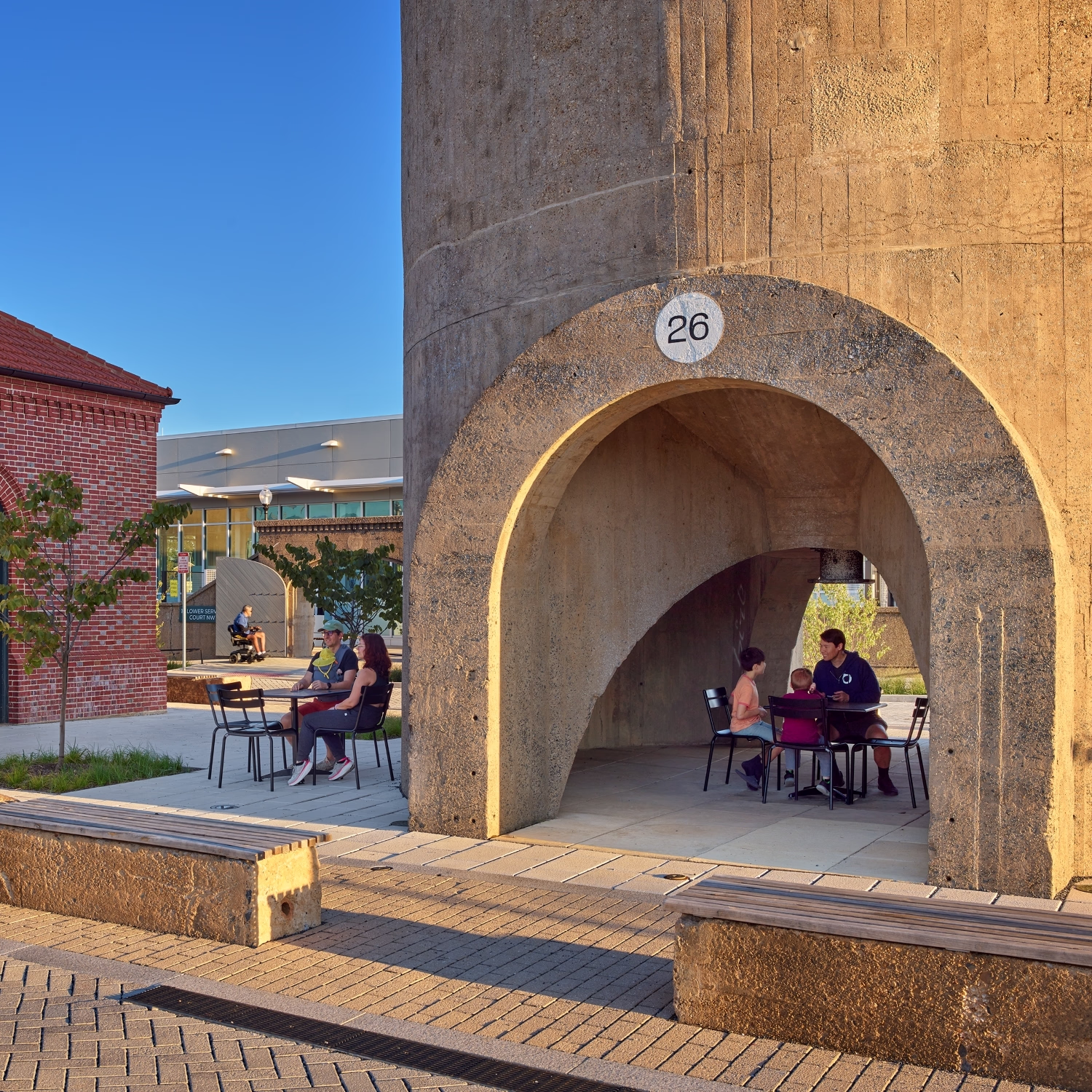 Community members sit at tables at the Reservoir Park Recreation Center.