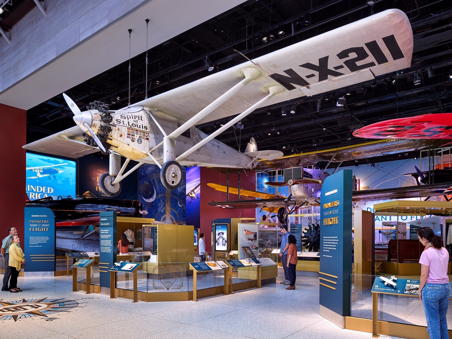 Visitors look at artifacts, including a plane, inside the National Air and Space Museum in Washington, DC.