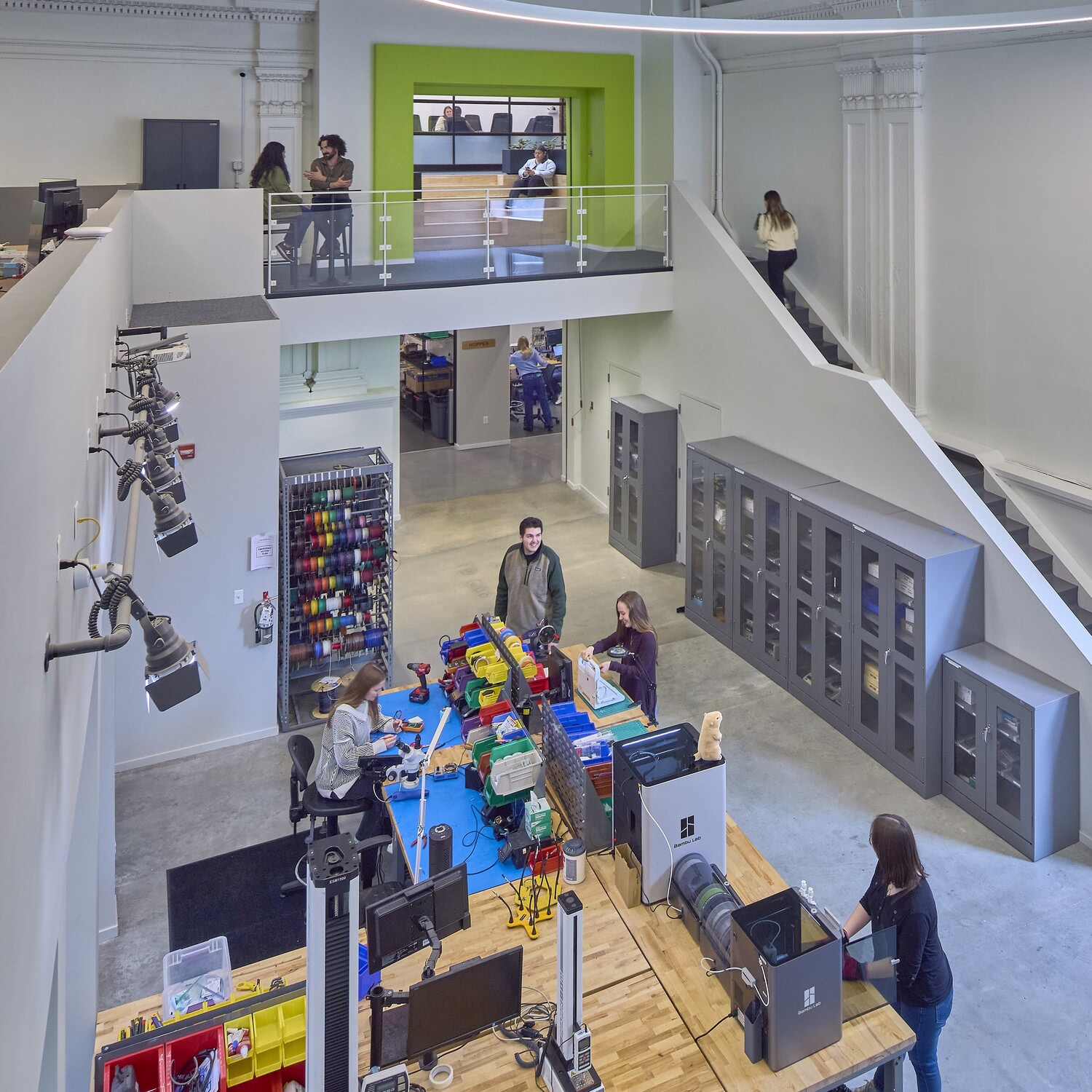 People work in a multi-level office.