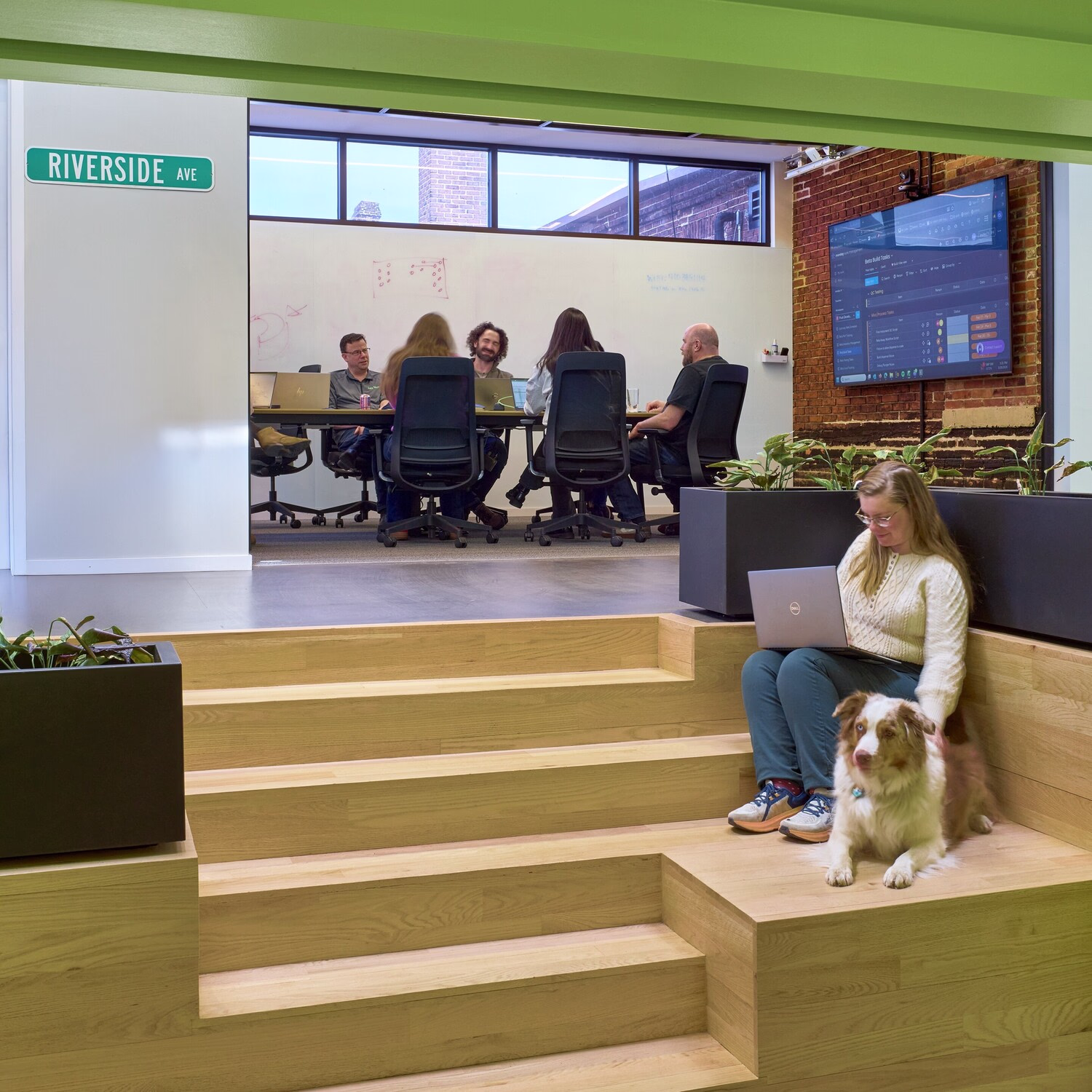 People collaborate inside an office.