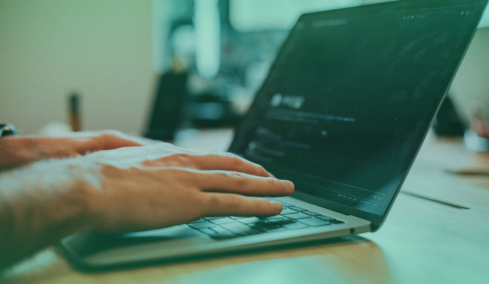 A person designing using the laptop