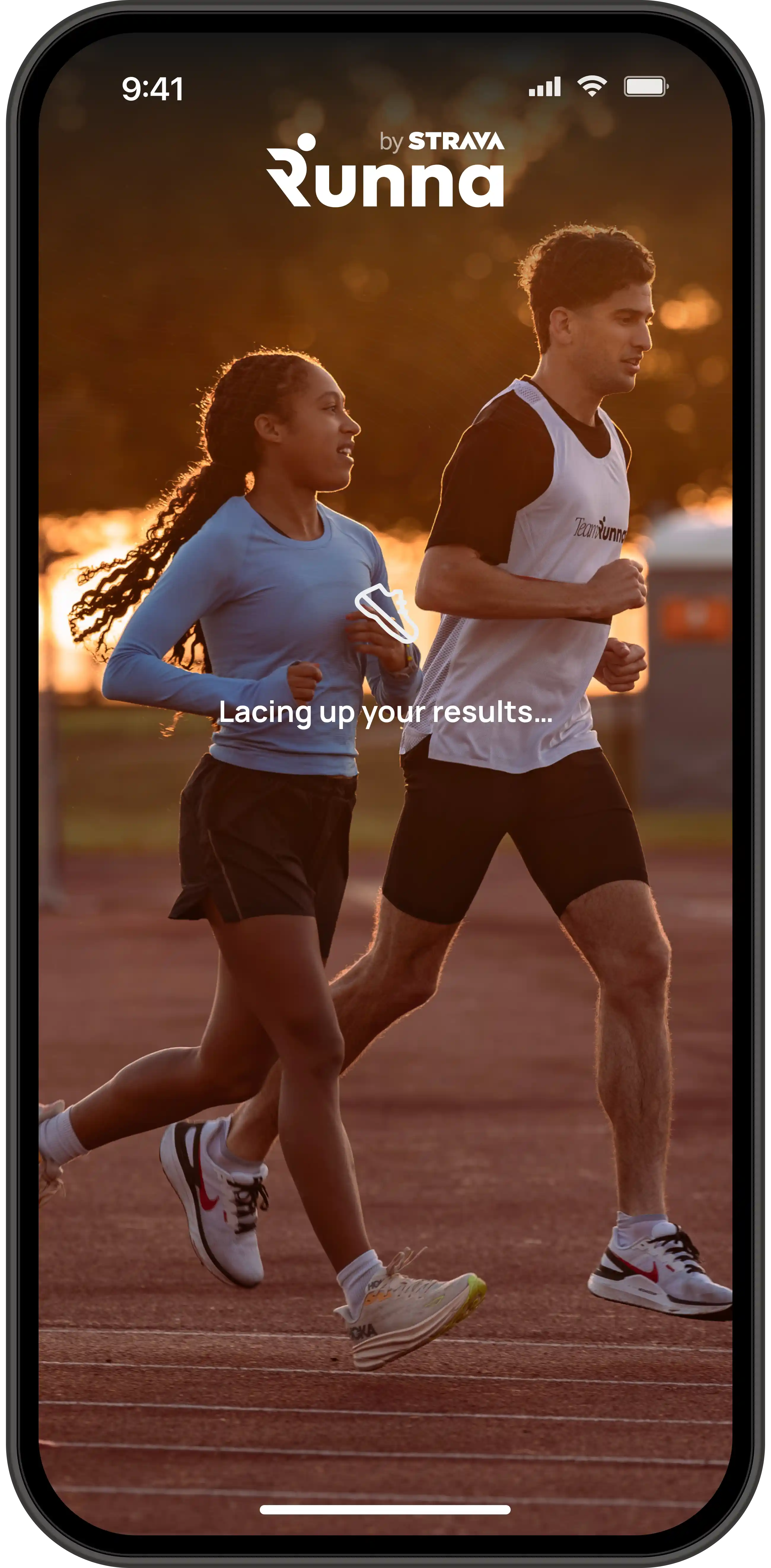 Two people running on a track at sunset with the Runna by Strava logo and the text 'Lacing up your results...' displayed on a smartphone screen.