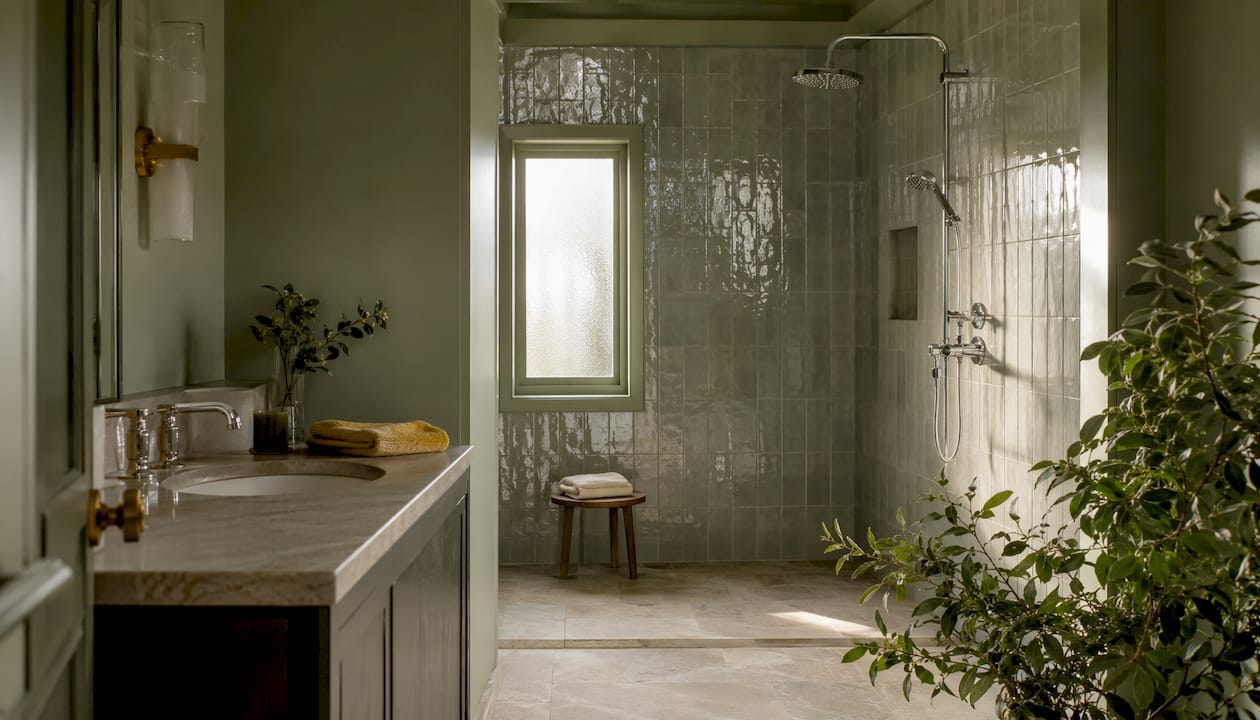 Bathroom with cohesive neutral color tile and paint