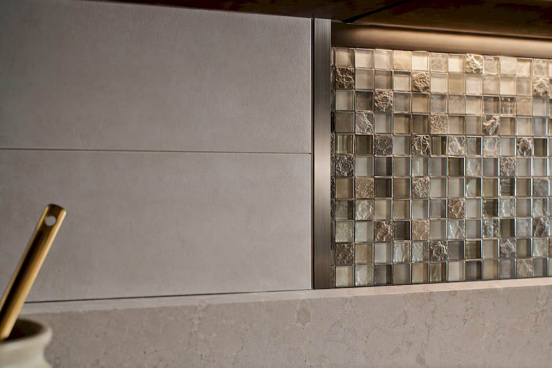 Ceramic glass and metal backsplash junction