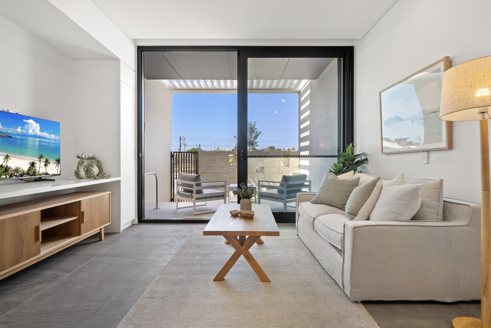 Living area opening onto a courtyard in a MadeComfy North Fremantle studio
