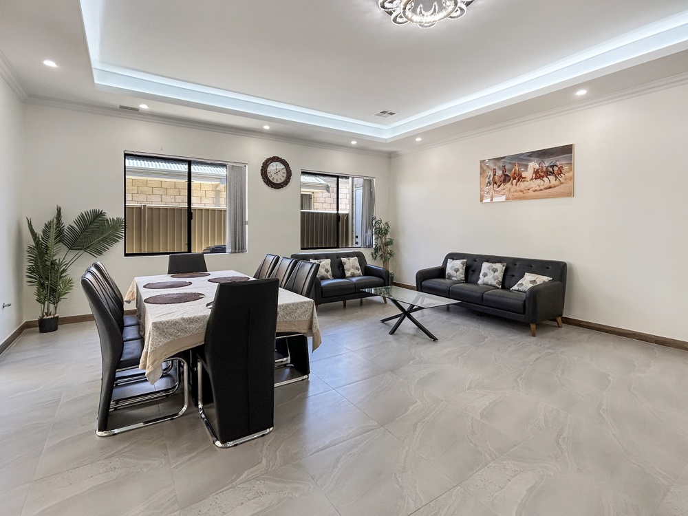 Open-plan living and dining room in a four-bedroom MadeComfy home in Southern River