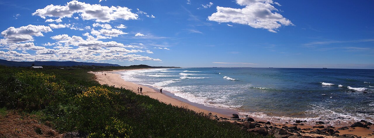 Sandy shoreline and ocean at Corrimal Beach in East Corrimal