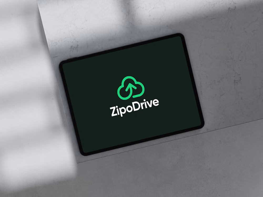 Tablet displaying the ZipoDrive logo with a green cloud and upward arrow on a dark screen.