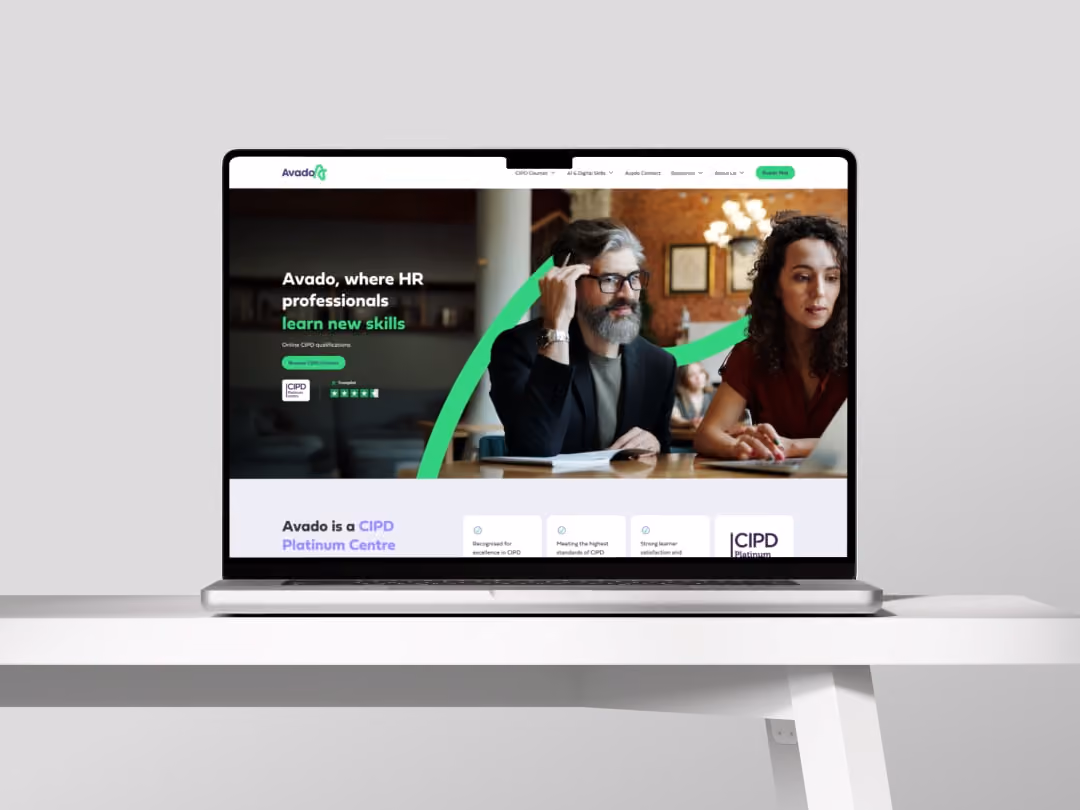 Laptop on white table showing Avado website for HR professionals learning new skills with CIPD courses.