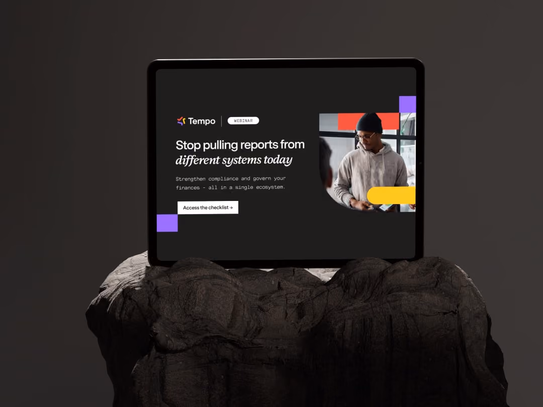 Tablet on rock with webinar ad: Stop pulling reports from different systems; strengthen finance compliance.