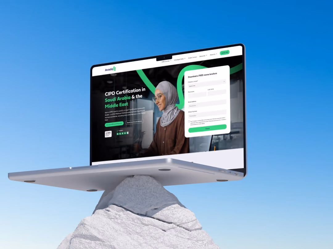 Laptop on a rock displaying a website for CIPD certification in Saudi Arabia and the Middle East.