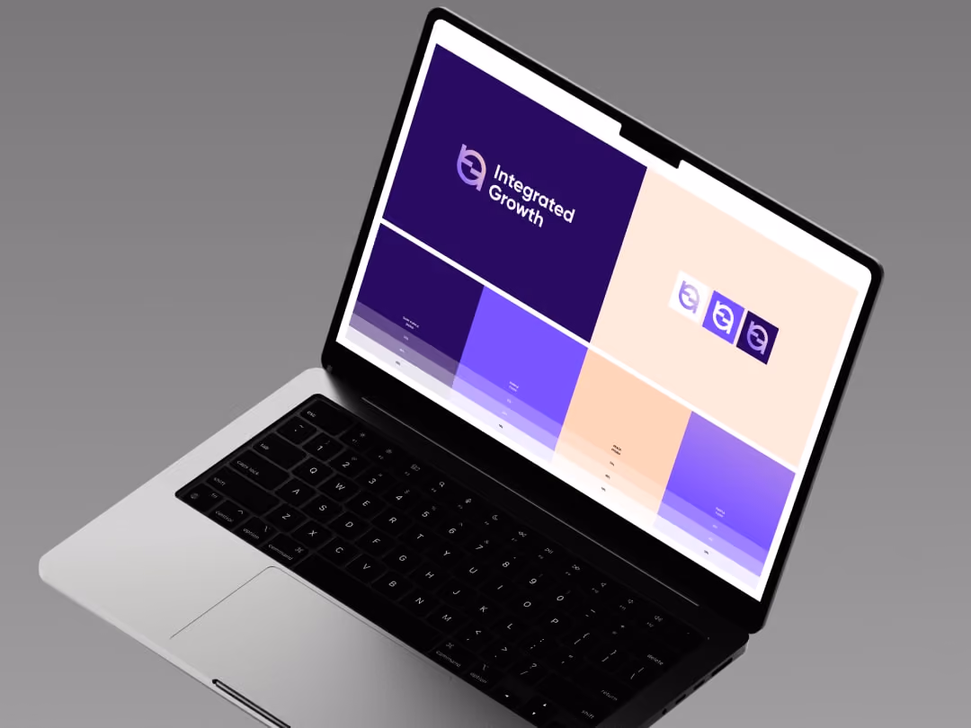 Laptop displaying a brand identity design with 'Integrated Growth' logo and color palette in purple and peach tones.