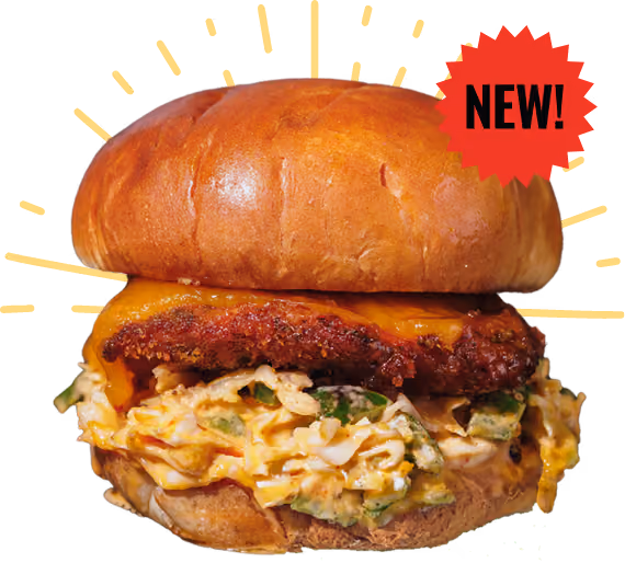 A mouthwatering burger with a glossy bun, layered with sauteed mushrooms, melted cheese, lettuce, and a juicy patty, set against a black background.