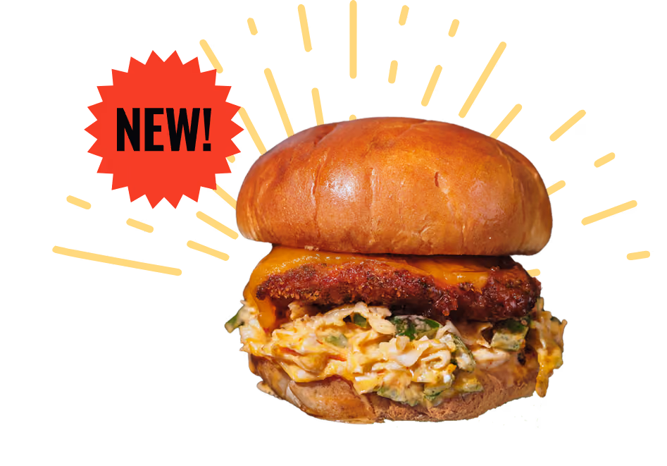 A mouthwatering burger with a glossy bun, layered with sauteed mushrooms, melted cheese, lettuce, and a juicy patty, set against a black background.