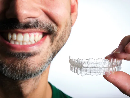 Man holding invisalign