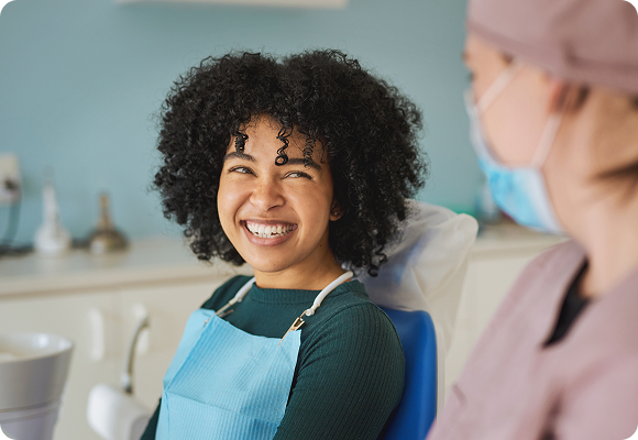 A woman smiling at her dentist 