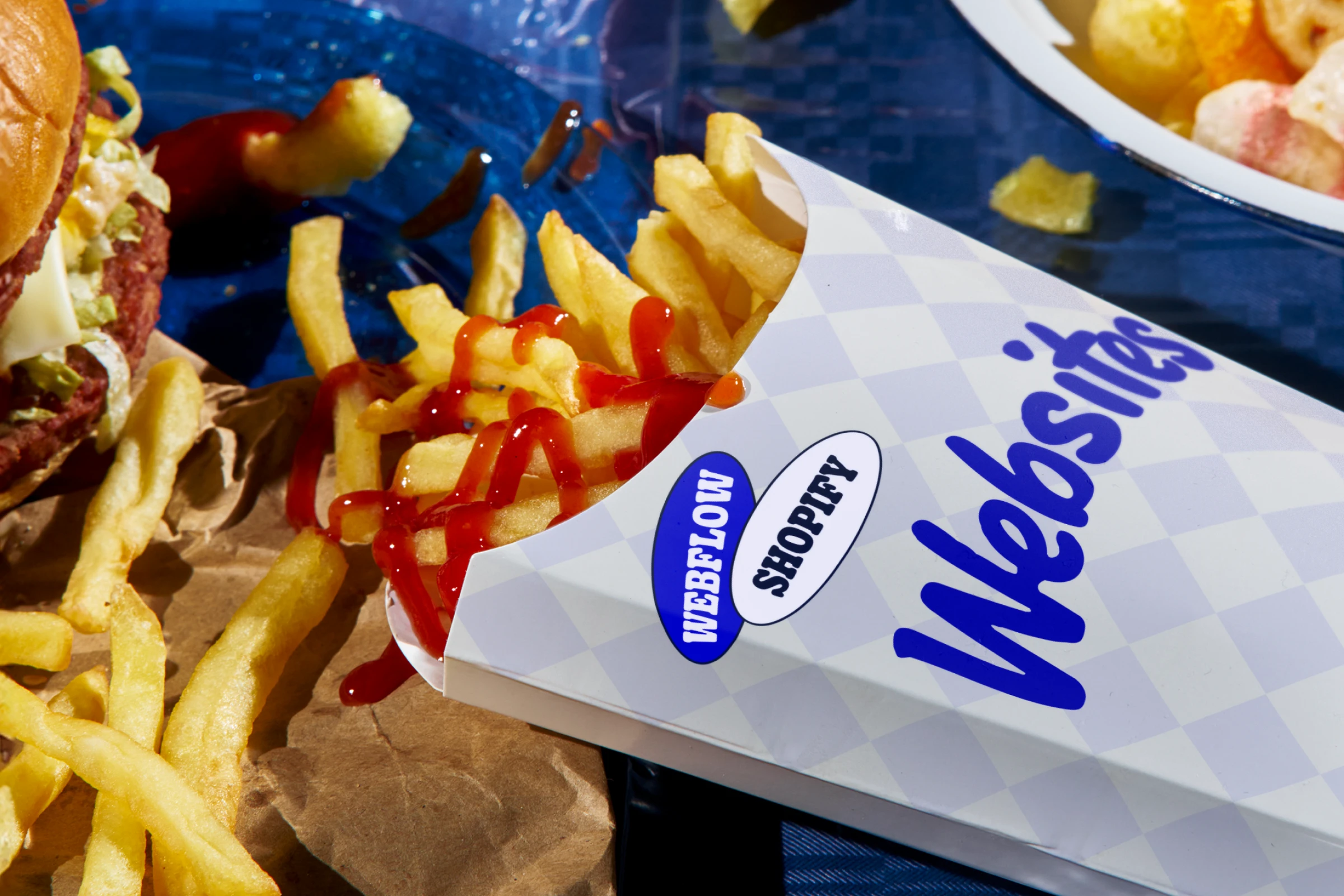 A cup of fries with a logo that says 'websites' on it