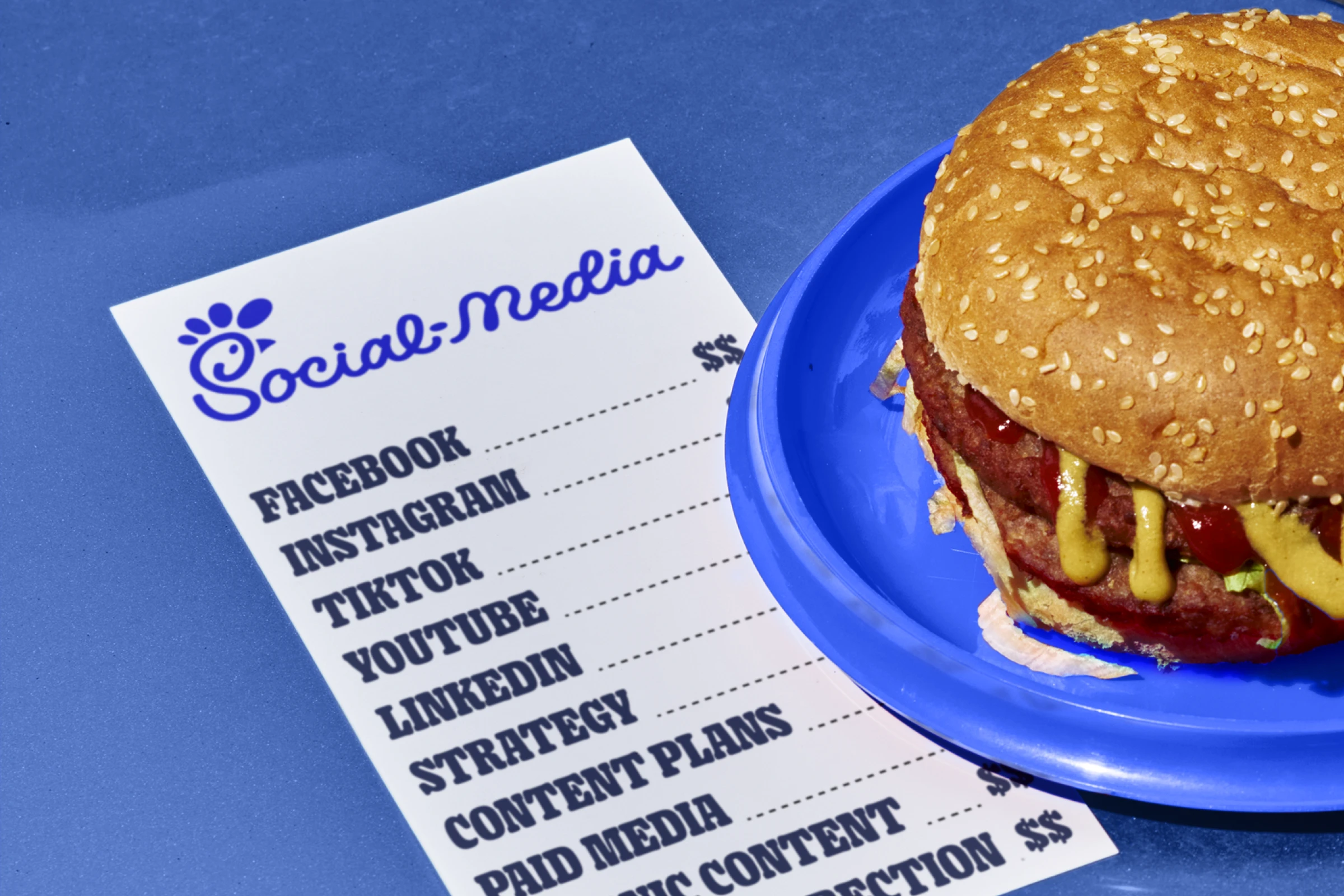 A burger store menu with the title 'social media', sitting next to a burger