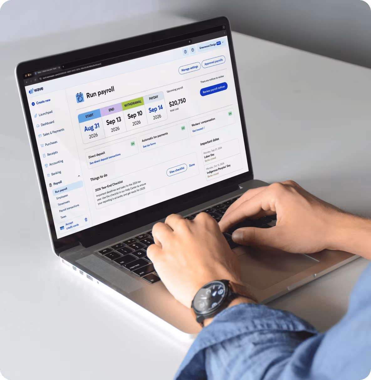 Business owner using Wave Payroll software on a laptop to run payroll, pay employees, manage tax payments, and streamline payroll processing.