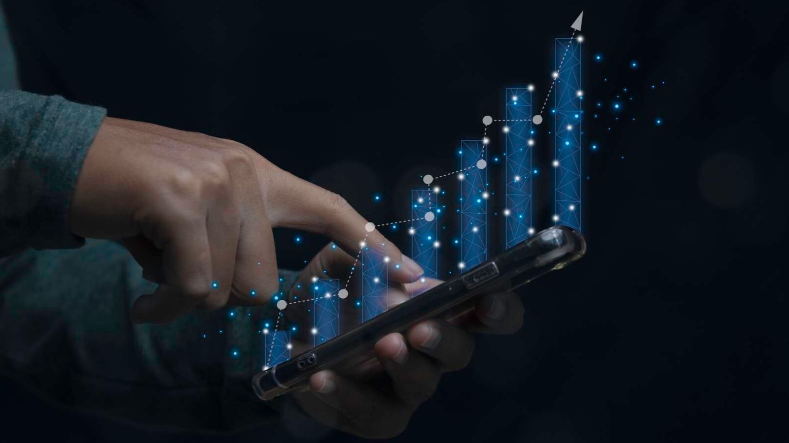 Hand using a smartphone with a digital growth chart overlay, symbolizing how Boston business VoIP and cloud PBX providers support expansion.