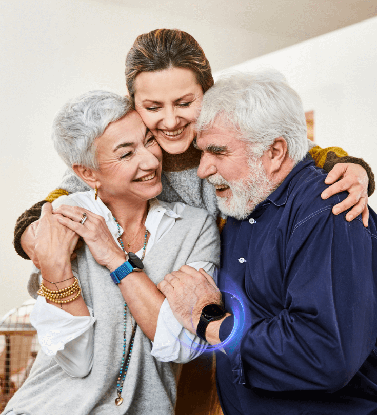A daughter hugging her parents who both wear a Patronus watch